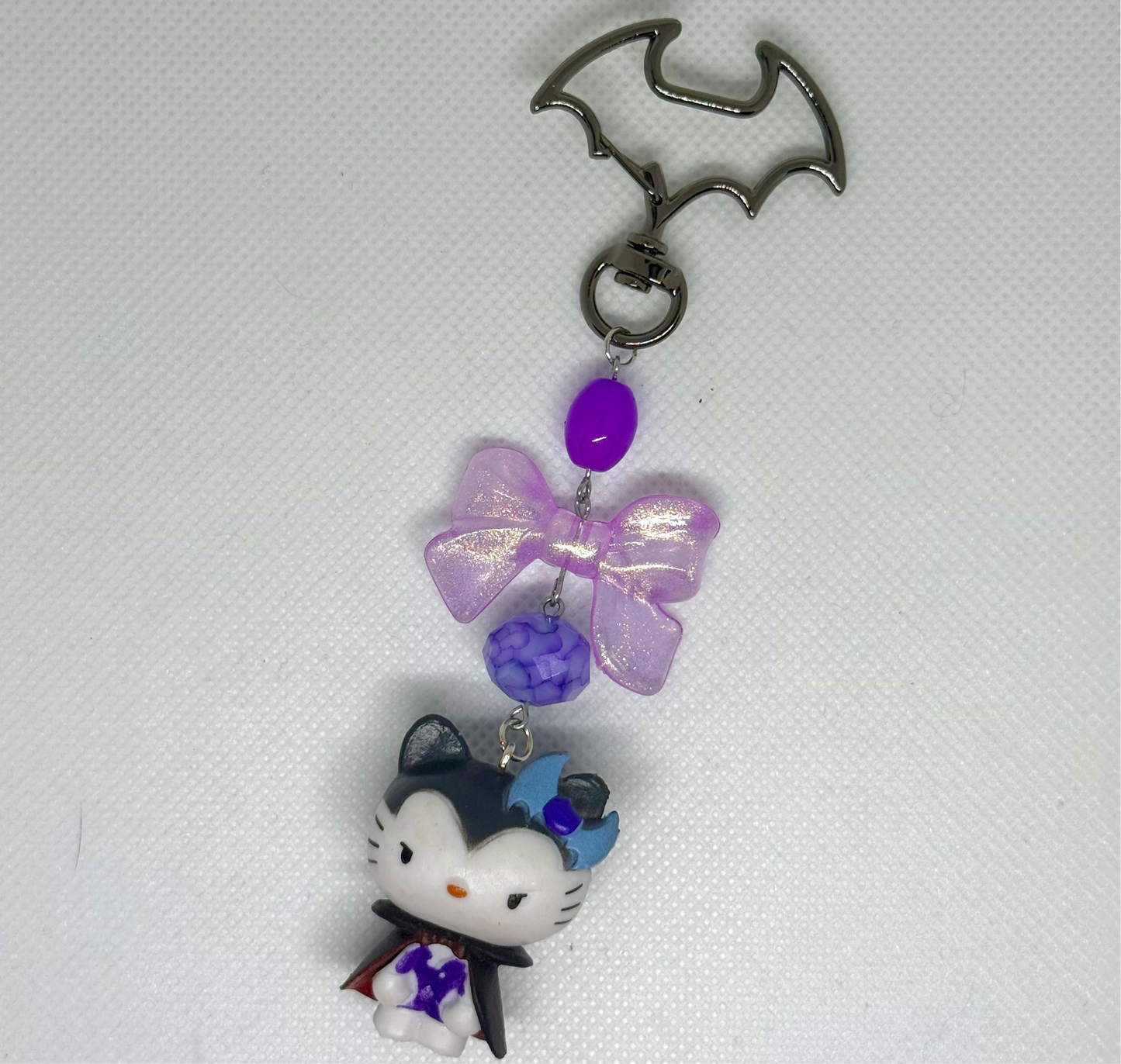 purple dracu-kitty charm