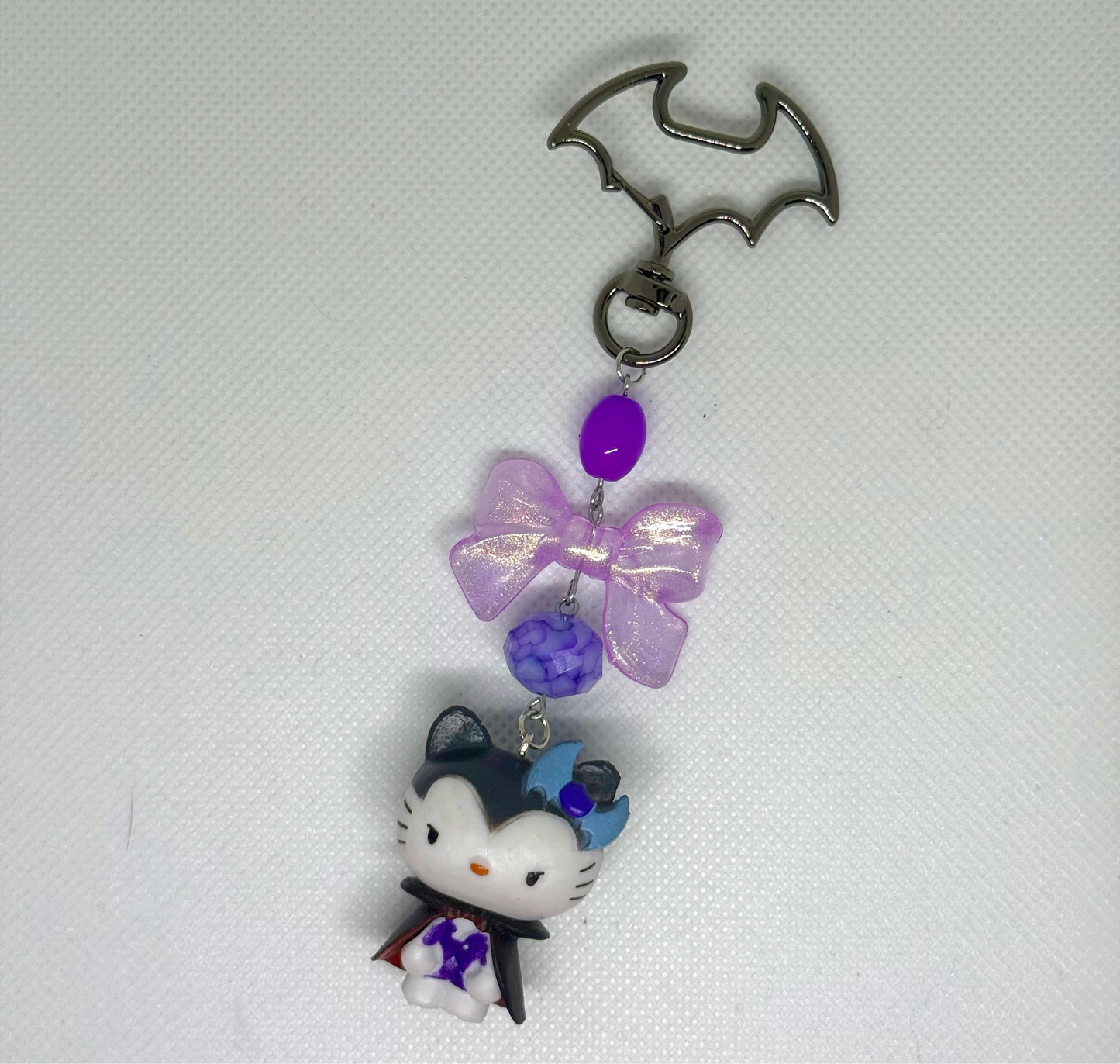 purple hello kitty dracula bag charm keychain